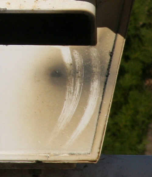 OFFENDER’S STAMP: A letterbox in Emerald that bears the burn marks of the small bomb which had been placed inside. ds-2300710-017 OFFENDER’S STAMP: A letterbox in Emerald that bears the burn marks of the small bomb which had been placed inside. ds-2300710-017